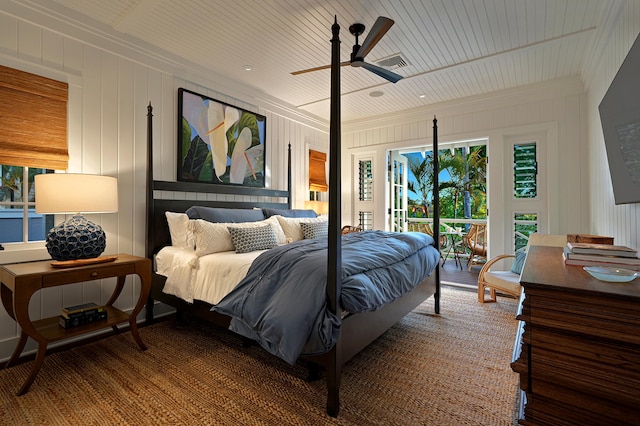 bedroom featuring wood ceiling, multiple windows, wooden walls, and ceiling fan