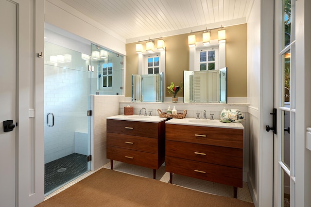 bathroom featuring vanity, a shower with door, and wooden ceiling