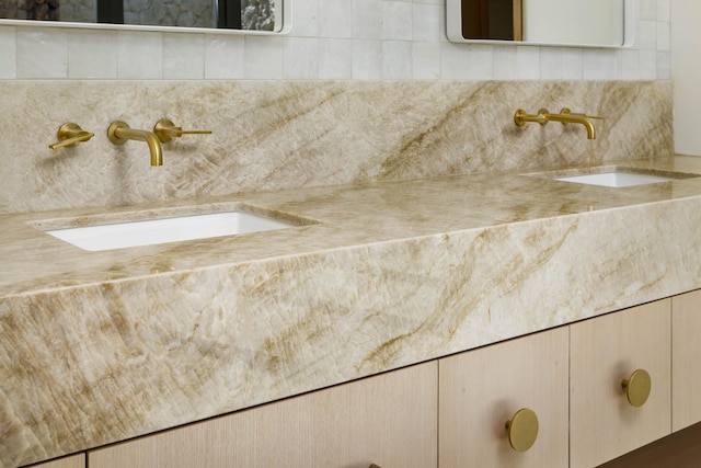 interior details with decorative backsplash and vanity