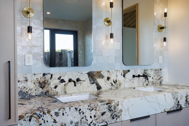 bathroom with decorative backsplash and vanity