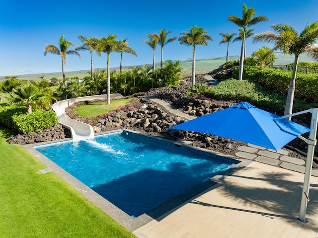 view of pool featuring a water slide