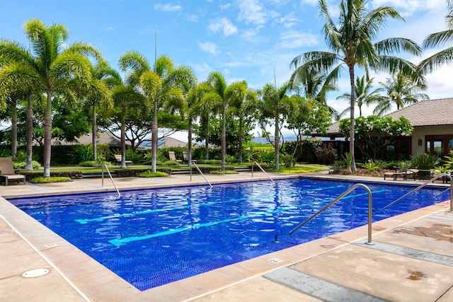 view of swimming pool featuring a patio area