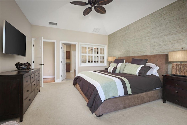 carpeted bedroom with ensuite bath, ceiling fan, and lofted ceiling