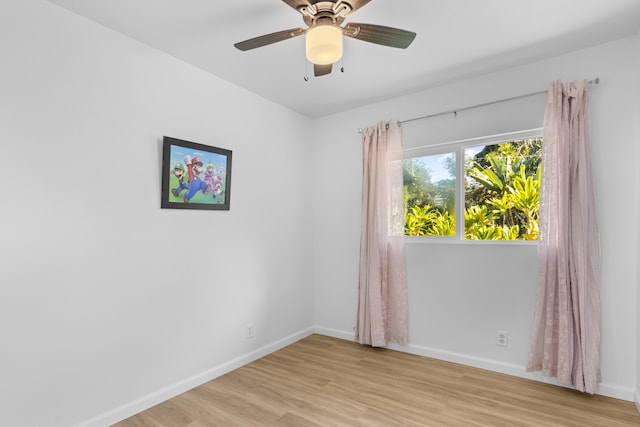 unfurnished room with ceiling fan and light hardwood / wood-style floors