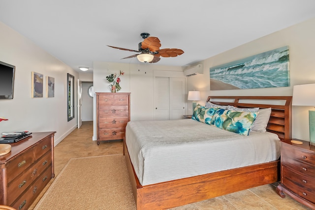 bedroom with a closet, a wall unit AC, and ceiling fan