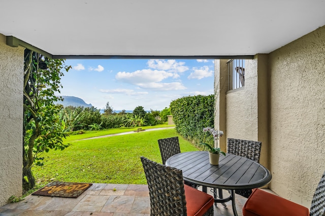 view of patio / terrace with a mountain view