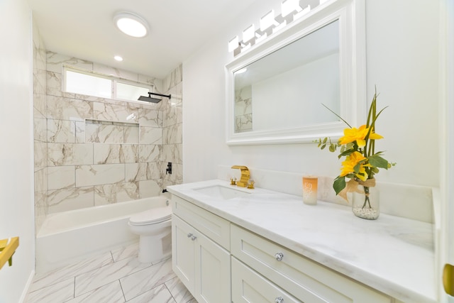 full bathroom with toilet, vanity, and tiled shower / bath