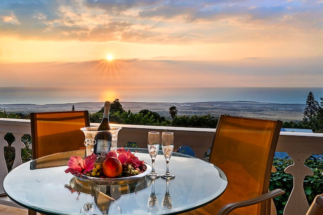 balcony at dusk with a water view