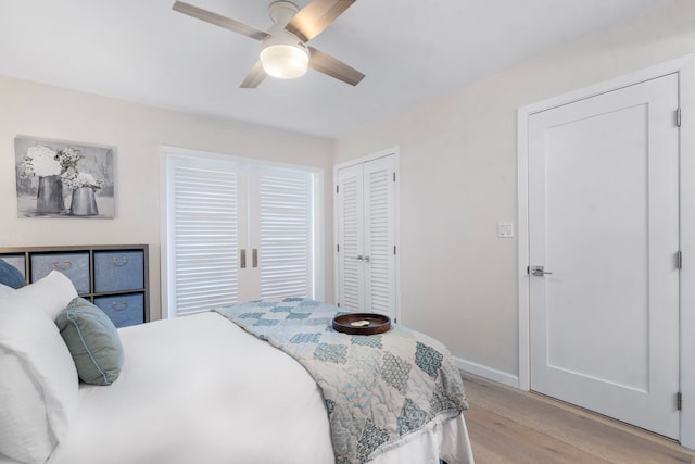 bedroom with ceiling fan, a closet, and light wood-type flooring