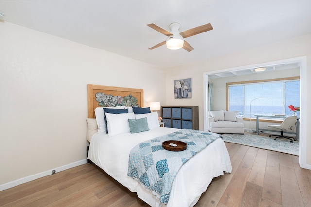 bedroom with hardwood / wood-style floors and ceiling fan