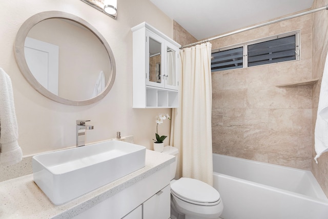 full bathroom featuring vanity, shower / bath combo, and toilet