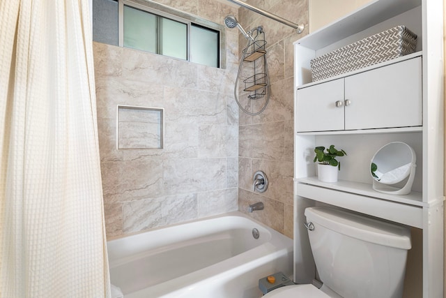 bathroom featuring shower / bath combo and toilet