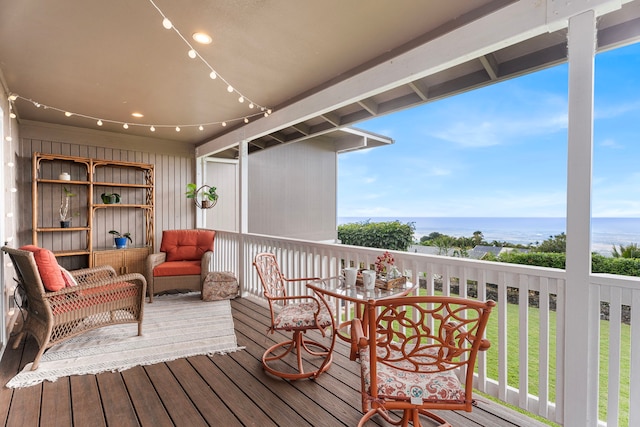 wooden deck with a water view