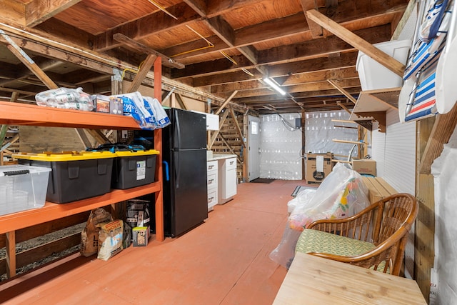 basement with black fridge