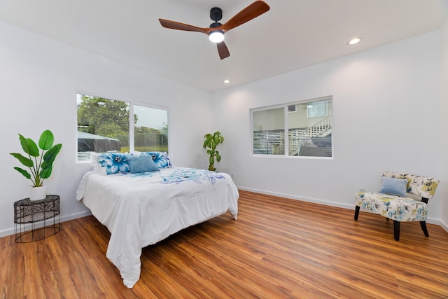 bedroom with wood-type flooring and ceiling fan