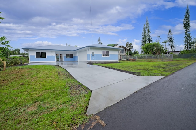 ranch-style home with a front lawn