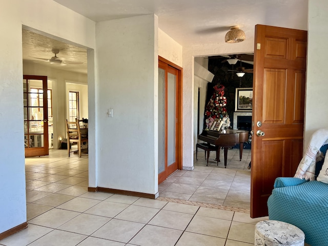 hall featuring light tile patterned floors