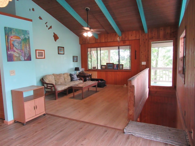 living room featuring wood ceiling, ceiling fan, light hardwood / wood-style flooring, and lofted ceiling with beams