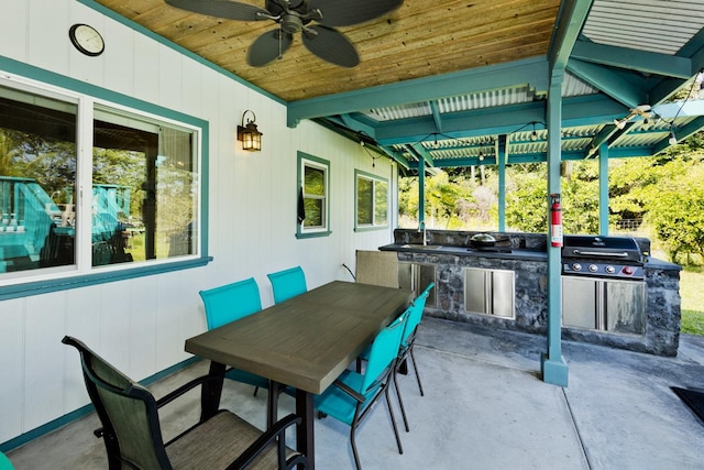 view of patio featuring area for grilling and ceiling fan