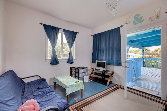 sitting room with a wealth of natural light and carpet floors