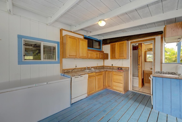 kitchen featuring dishwasher, sink, light wood-type flooring, light brown cabinetry, and beamed ceiling