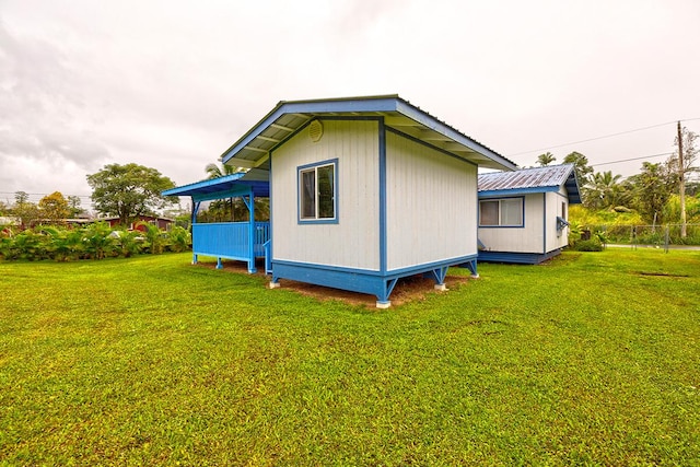 view of home's exterior with a yard