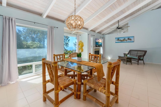 tiled dining space featuring vaulted ceiling with beams, wooden ceiling, and ceiling fan with notable chandelier