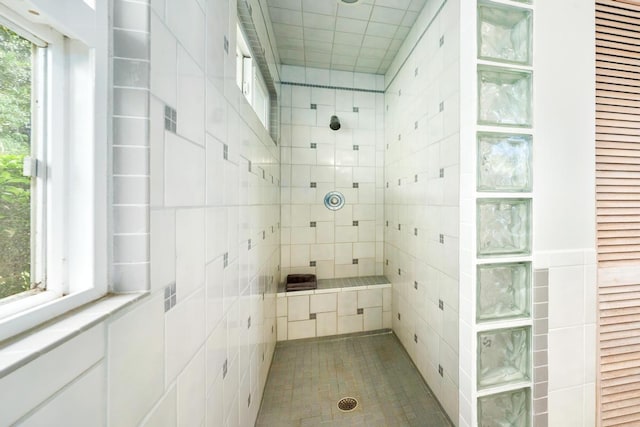 bathroom featuring tiled shower