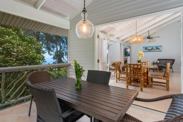 tiled dining area featuring lofted ceiling with beams, ceiling fan, and wood ceiling