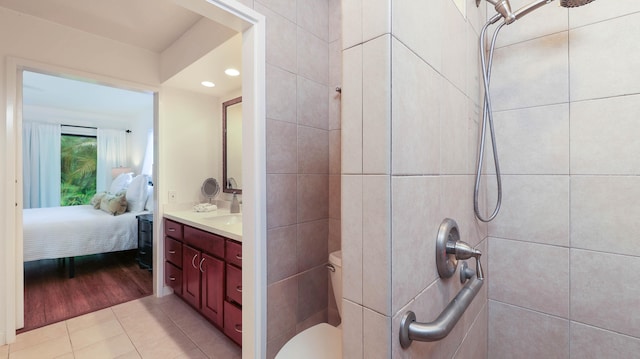 bathroom featuring tile patterned flooring, vanity, and toilet