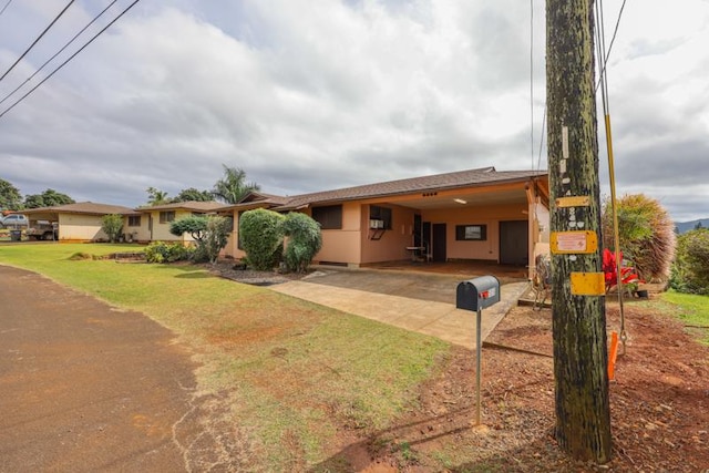 single story home with a carport and a front yard