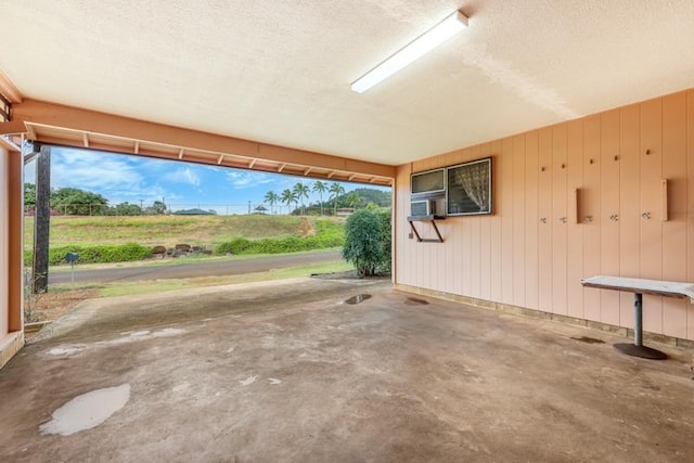 view of patio / terrace with cooling unit and a rural view