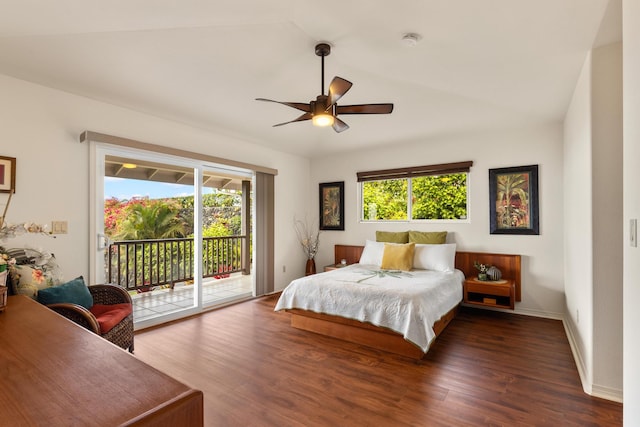 bedroom featuring access to outside, multiple windows, ceiling fan, and dark wood-type flooring