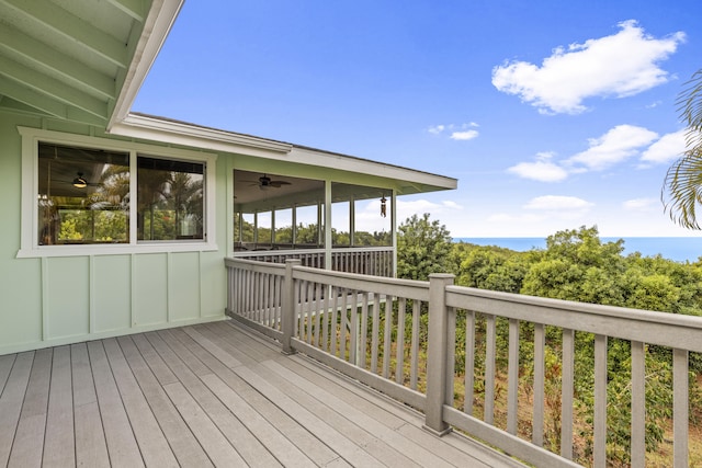 wooden terrace featuring ceiling fan