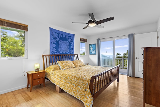 bedroom featuring access to outside, light hardwood / wood-style floors, and ceiling fan