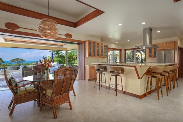 dining area with a tray ceiling