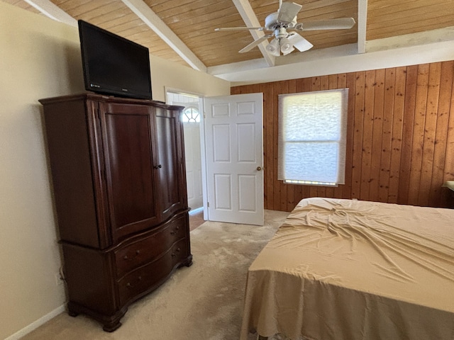 bedroom with wood walls, wooden ceiling, ceiling fan, beamed ceiling, and light colored carpet