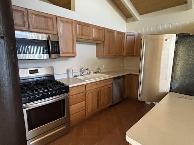 kitchen featuring lofted ceiling with beams, dark parquet floors, sink, appliances with stainless steel finishes, and wood ceiling