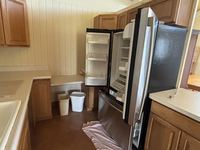 kitchen with wooden walls and sink