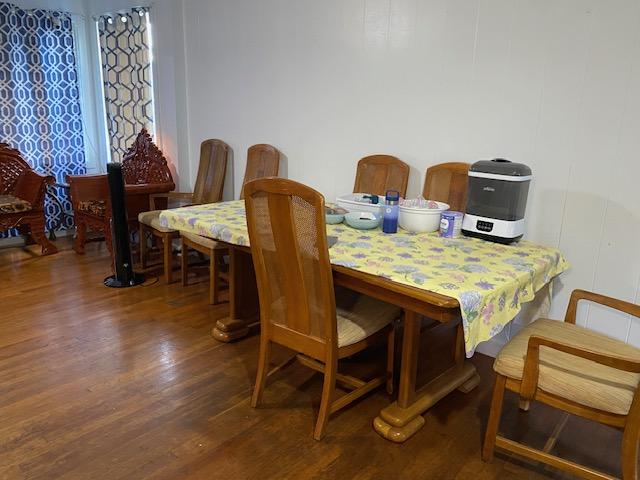 dining space with dark hardwood / wood-style flooring