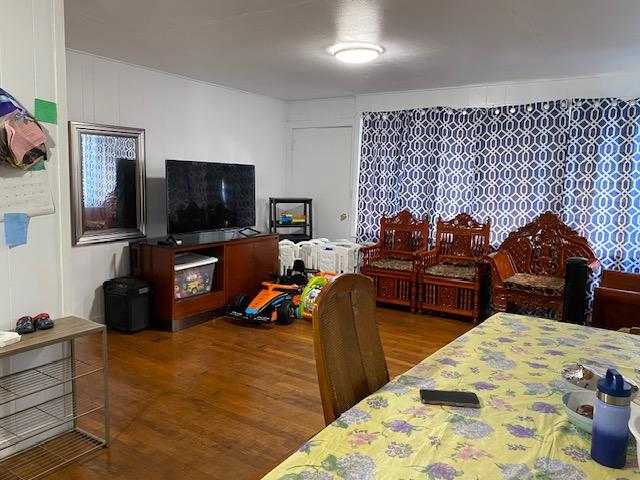 bedroom with wood-type flooring