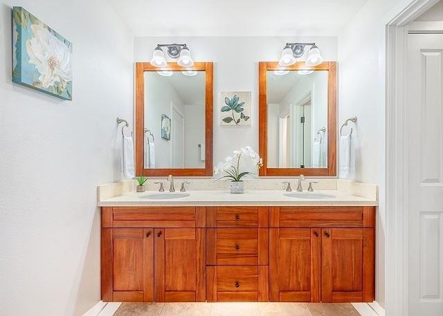 bathroom with tile patterned flooring and vanity