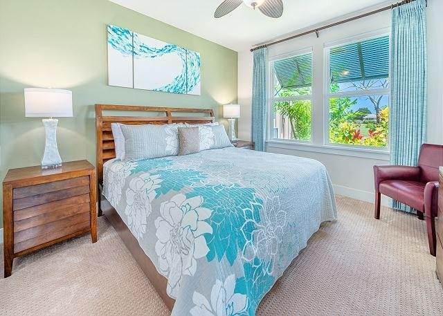 bedroom featuring light colored carpet and ceiling fan