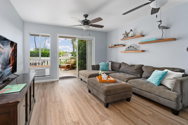 living room with light hardwood / wood-style flooring, ceiling fan, and cooling unit