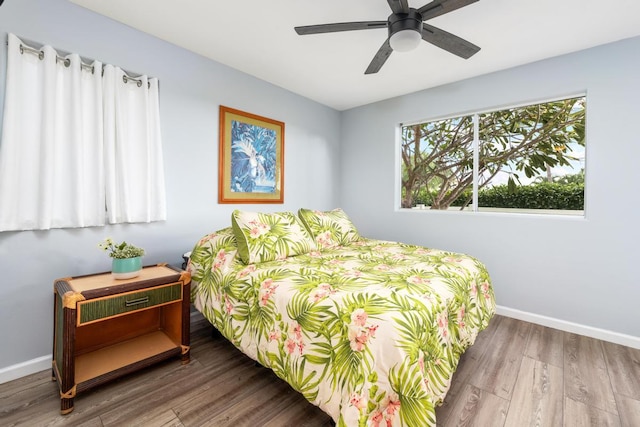 bedroom featuring hardwood / wood-style floors and ceiling fan