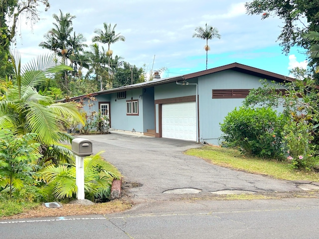 ranch-style house featuring a garage