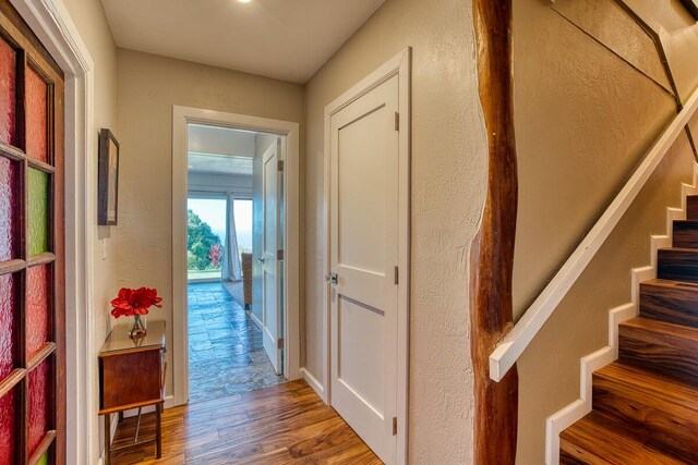 hallway with wood-type flooring