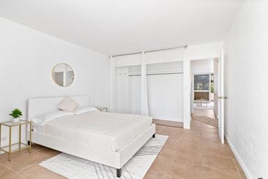 bedroom featuring a closet and light tile patterned floors