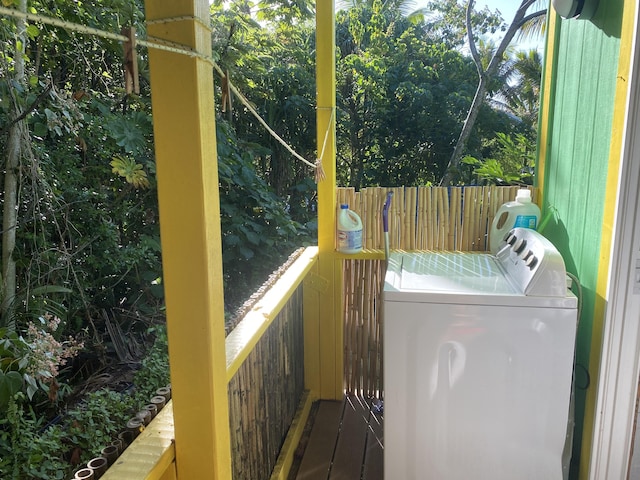 clothes washing area with separate washer and dryer