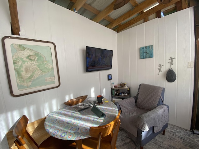 living area featuring beam ceiling